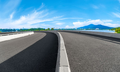 Empty asphalt road square and natural landscape under the blue sky