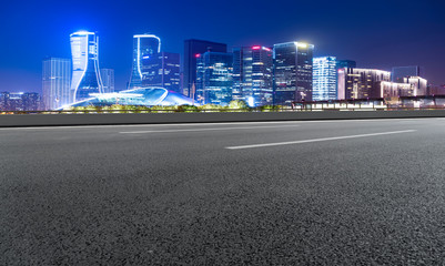 Obraz premium Road Pavement and Night View of Hangzhou Urban Architecture..