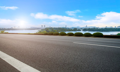 Empty asphalt road square and natural landscape under the blue sky