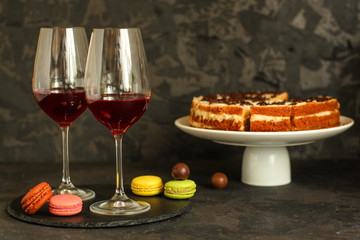 red wine in a transparent glass (dark background). copy space