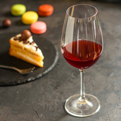 red wine in a transparent glass (dark background). copy space