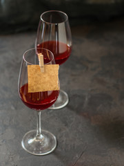 red wine in a transparent glass (dark background). copy space