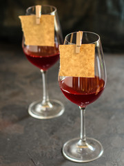red wine in a transparent glass (dark background). copy space