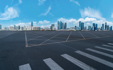 Empty asphalt road along modern commercial buildings in China,s cities