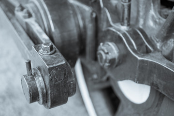 BW image of the details of the old Steam locomotive with cranks and wheels