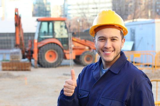 Ethnic construction worker giving a thumbs up