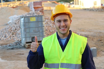 Ethnic construction worker giving a thumbs up 