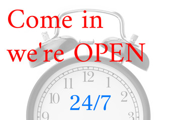 Come in we're OPEN sign in red and white, on shop door