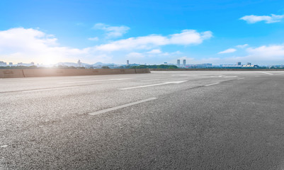 Fototapeta premium Empty asphalt road square and natural landscape under the blue sky