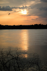 Naklejka premium sunset over lake beack