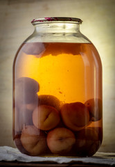 Bank of canned fruit compote on the shelf