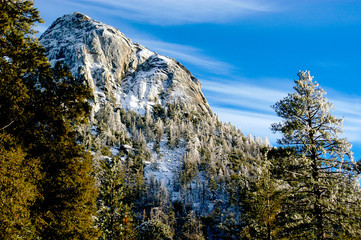 Mountain Tahquitz covered in snow as the sun begins to melt it away in Idyllwild, California. 