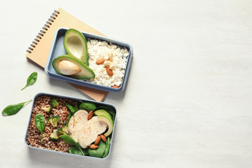 Flat lay composition with container of natural protein food on light background. Space for text