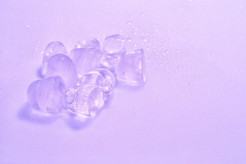Ice cubes on color background. Space for text