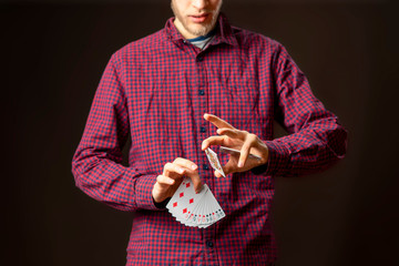 closeup portrait of teen male hold gambling card show it and cover face b