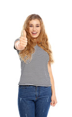 Happy young woman showing thumb up gesture on white background. Celebrating victory