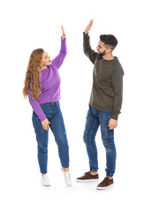 Fototapeta premium Happy young people celebrating victory on white background