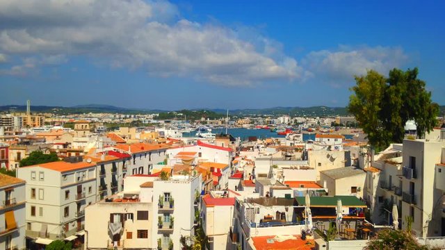 Cinemagraph - Clouds floating over the port of the Town of Ibiza on Ibiza Island.