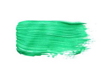 Abstract brushstroke of green paint isolated on white