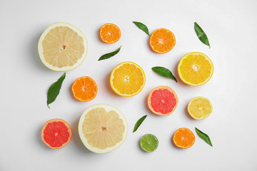 Fototapeta na wymiar Different citrus fruits on white background, flat lay