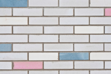 Brick wall with colored bricks. City backgrounds.