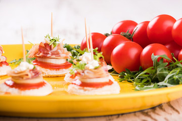 Canapes with bacon and onion