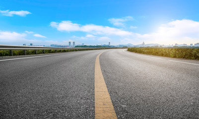 Empty asphalt road square and natural landscape under the blue sky