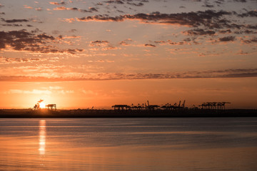 sunrise over ocean container terminal