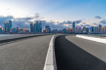 Fototapeta premium Empty asphalt road along modern commercial buildings in China,s cities