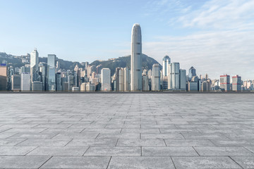 Obraz premium Empty marble floors and city views under the blue sky