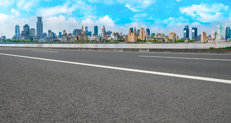 Empty asphalt road along modern commercial buildings in China,s cities