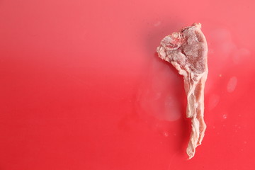 frozen lamb ribs on colorful background