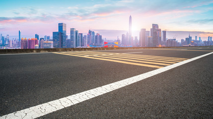 Empty asphalt road along modern commercial buildings in China,s cities