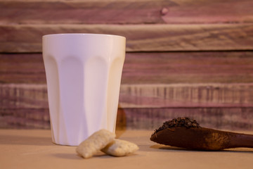 Cup of coffee for breakfast. Wooden rustic background.