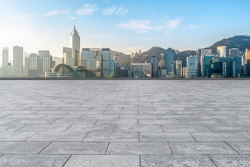 Empty marble floors and city views under the blue sky