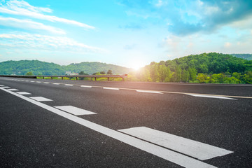 Empty asphalt road square and natural landscape under the blue sky