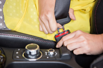 Woman hand holding a seat belt