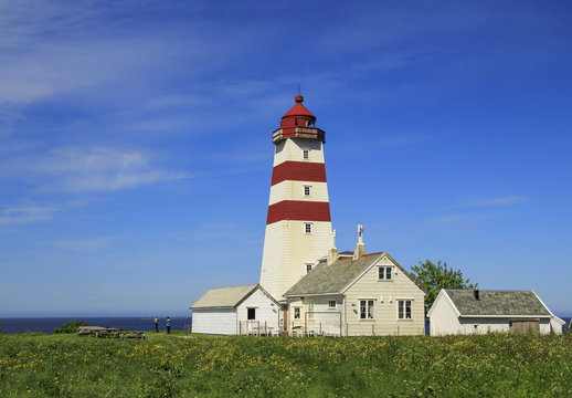 Alnes lighthouse at clear sky at Godoy island near Alesund,