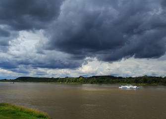 Boat on the lake under the black clouds