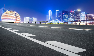 Road Pavement and Night View of Hangzhou Urban Architecture..