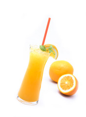 Orange juice from natural citrus fruit in a clear glass on a white background.soft focus.
