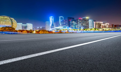 Road Pavement and Night View of Hangzhou Urban Architecture..