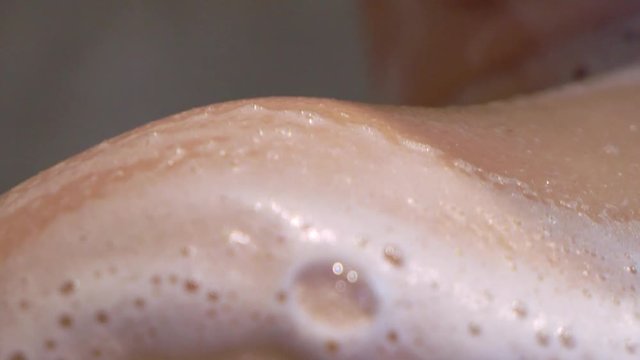 Young nude sexy woman taking shower in bathroom