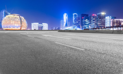 Road Pavement and Night View of Hangzhou Urban Architecture..