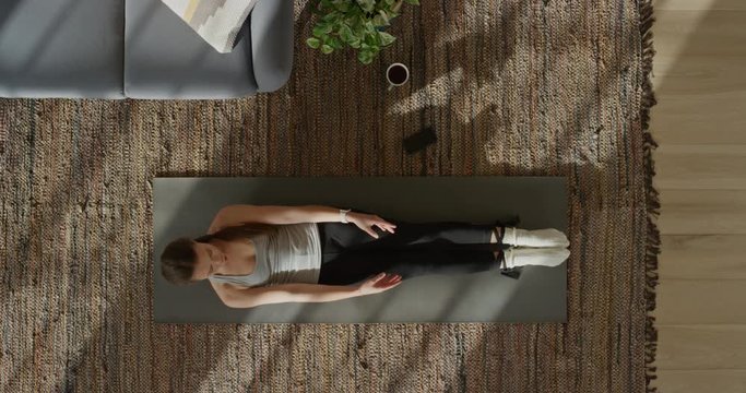 top view yoga woman practicing corpse pose exercising healthy lifestyle training at home on exercise mat enjoying mindfulness meditation