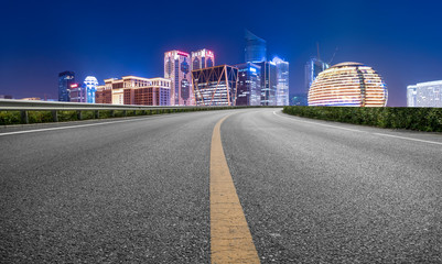 Road Pavement and Night View of Hangzhou Urban Architecture..