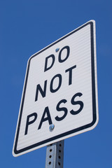 The "Do not pass" sign with California blue skies in the background. 