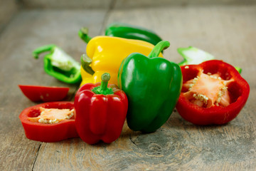 Fresh Colorful Bell pepper Half cut isolate on wood
