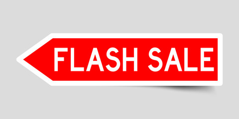 Arrow shape red color sticker in word flash sale on gray background