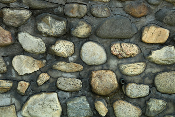 Brick wall with natural stones